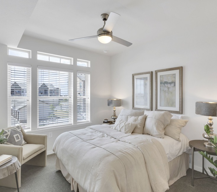 Primary bedroom with ceiling fan